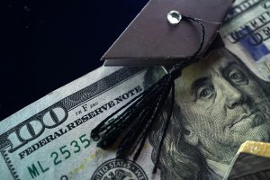 Money with a graduation hat