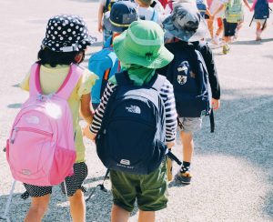 kids with backpacks on a field trip