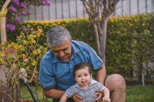 A man and a little kid outside