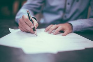 Lawyer writing on paper