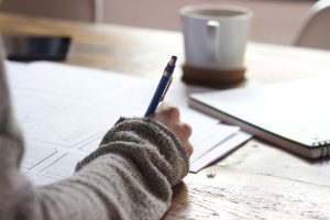 a person signing papers